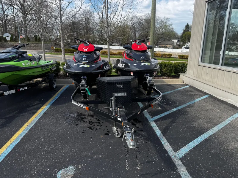 The Image of Two 2011 Sea-Doo RXT 260 jet skis parked on a trailer outdoors. - 0
