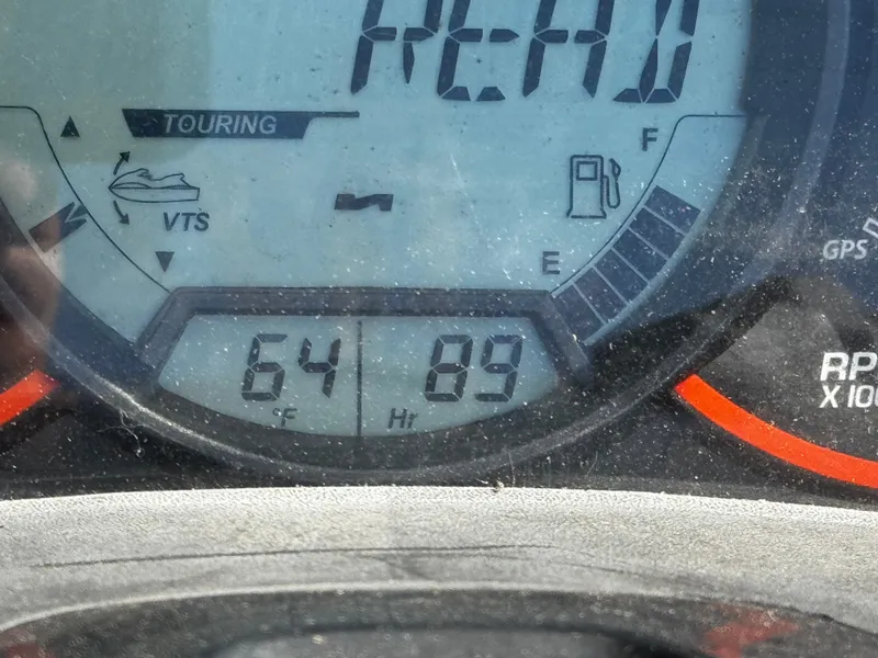 Slide: The Image of Dashboard of 2011 Sea-Doo RXT 260 showing 64°F and 89 hours. - 11