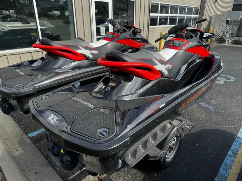 Slide: The Image of Two 2011 Sea-Doo RXT 260 jet skis on a trailer. - 3