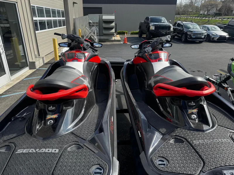 Slide: The Image of Two 2011 Sea-Doo RXT 260 jet skis parked side by side. - 7
