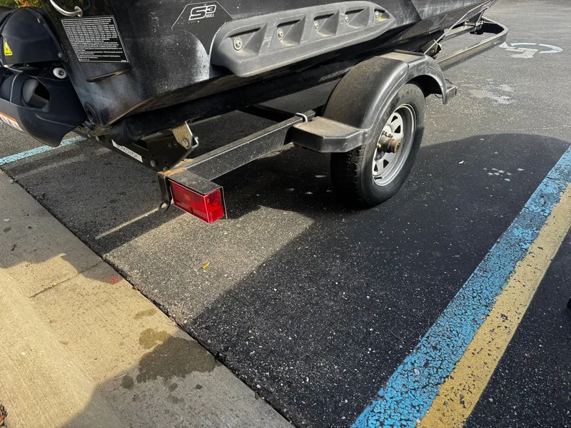 Slide: The Image of 2011 Sea-Doo RXT 260 on trailer in parking lot. - 9