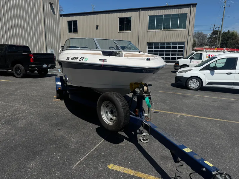 Slide: The Image of 2006 Four Winns 180 Horizon boat parked on trailer. - 5