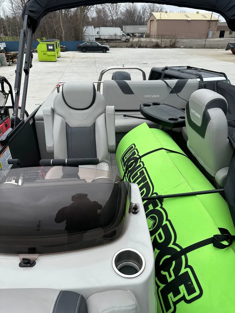 Slide: The Image of Interior of a 2022 Sylvan L3 CLZ TT boat with green water sports gear. - 11