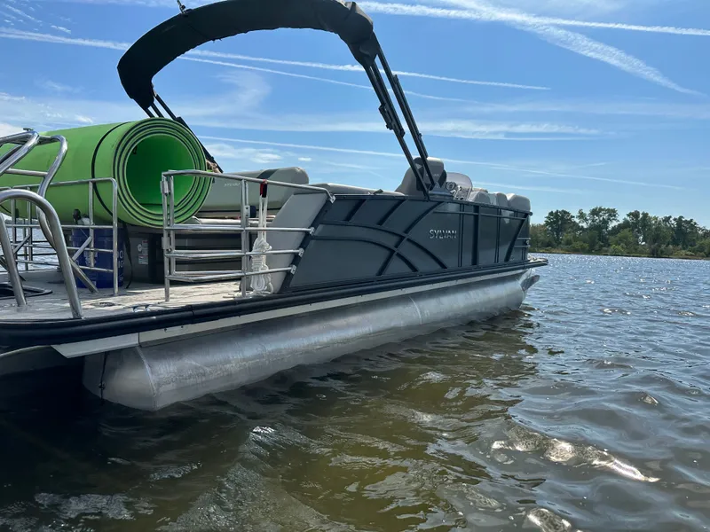 Slide: The Image of Sylvan L3 CLZ TT 2022 pontoon boat on calm water. - 2