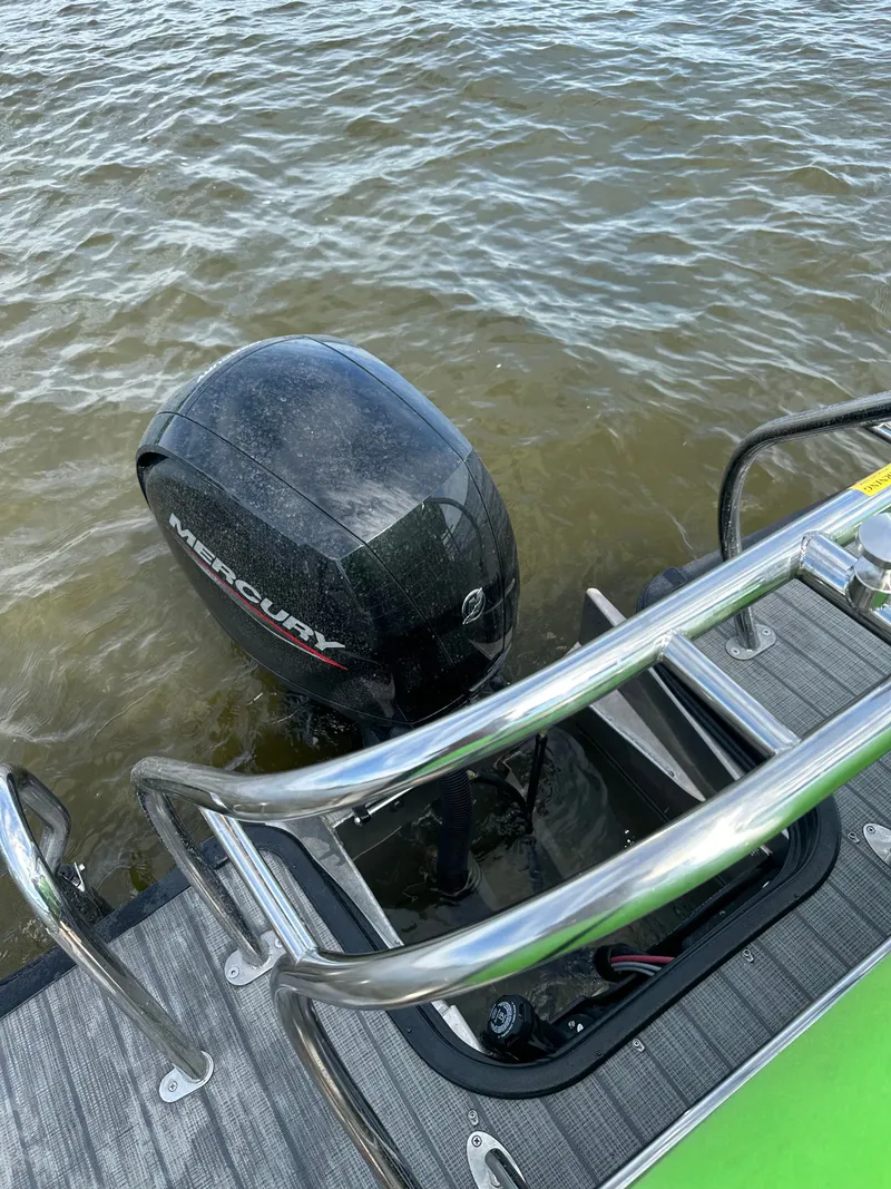Slide: The Image of 2022 Sylvan L3 CLZ TT with Mercury outboard motor in water. - 3