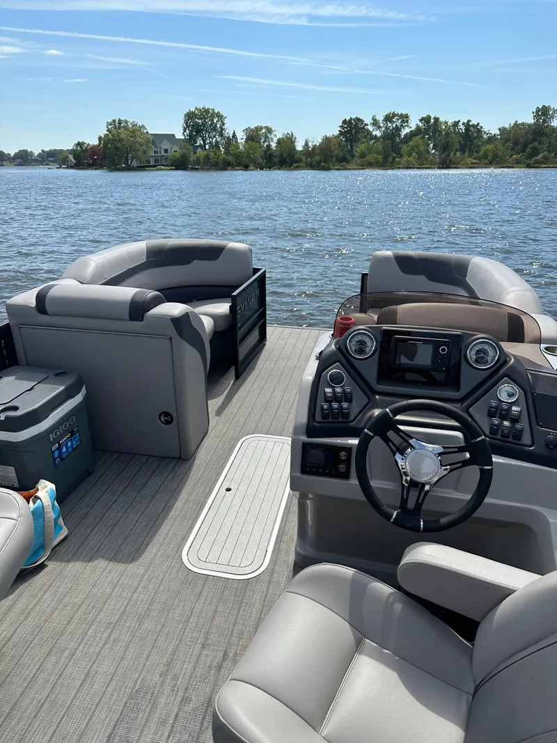 Slide: The Image of Interior of a 2022 Sylvan L3 CLZ TT boat on a lake. - 7