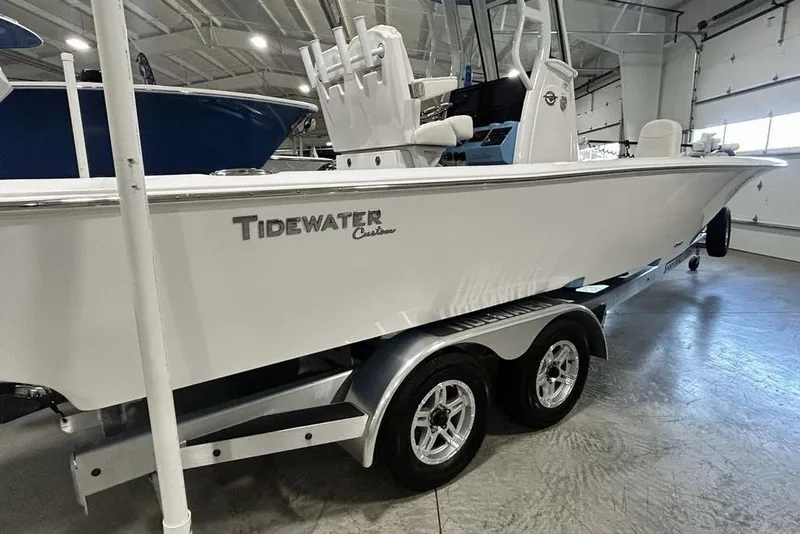 Slide: The Image of 2026 Tidewater 2500 Carolina Bay boat on trailer in showroom. - 3