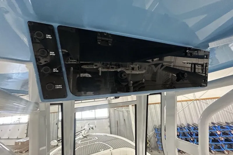Slide: The Image of Control panel of 2026 Tidewater 2500 Carolina Bay boat with light switches. - 4