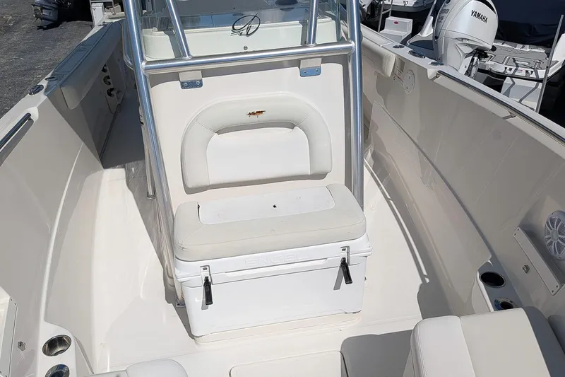 Slide: The Image of 2014 Sailfish 270 CC boat interior with seating and storage. - 20