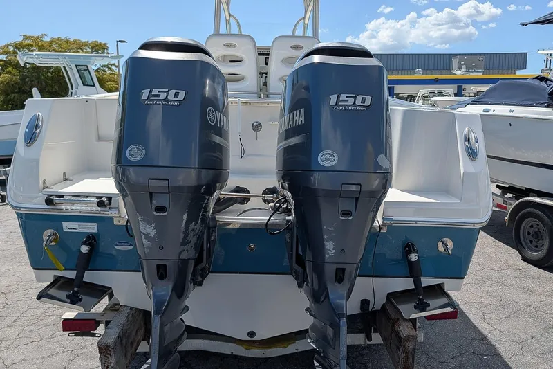 Slide: The Image of 2014 Sailfish 270 CC boat with twin Yamaha 150 outboard engines. - 5