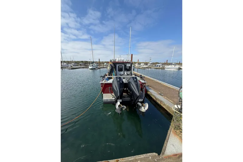 Slide: The Image of 2017 Weldcraft 260 Cuddy King docked at marina under blue sky. - 11