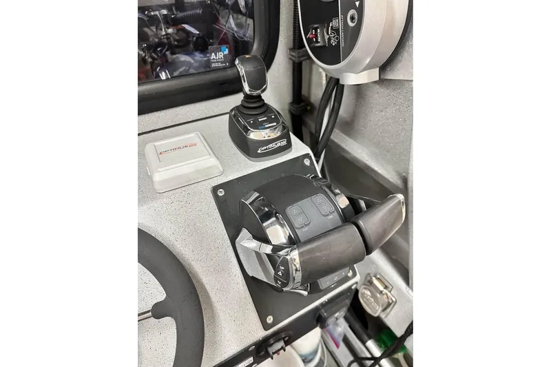 Slide: The Image of Control panel of a 2017 Weldcraft 260 Cuddy King boat cockpit. - 2