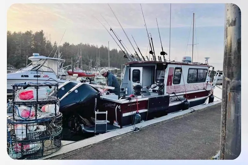 Slide: The Image of 2017 Weldcraft 260 Cuddy King boat docked with fishing gear and crab pots. - 7