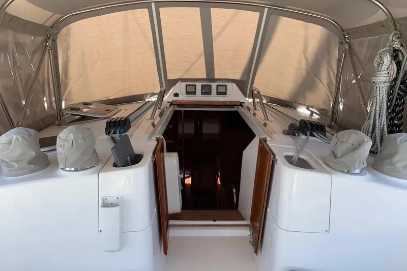 Slide: The Image of Interior view of a 2000 Hunter 460 sailboat cockpit with covered instruments. - 13