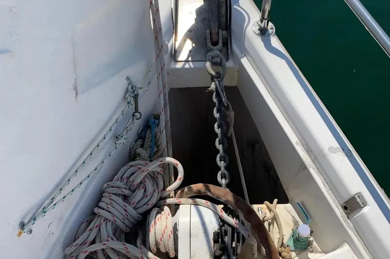 Slide: The Image of Anchor chain and ropes on a 2000 Hunter 460 sailboat deck. - 17