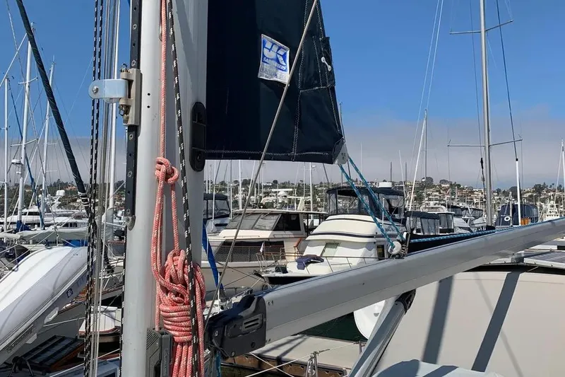 Slide: The Image of Sailboat mast and rigging at marina, Hunter 460, year 2000, with boats in background. - 20