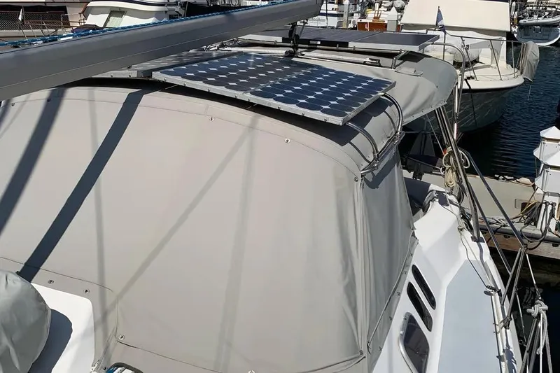 Slide: The Image of Hunter 460 sailboat from 2000 with solar panels installed on the deck. - 21