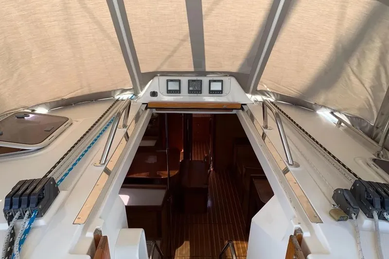 Slide: The Image of Interior view of a 2000 Hunter 460 sailboat cockpit with navigation instruments. - 23