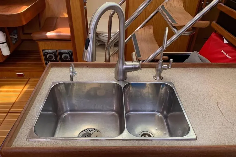 Slide: The Image of Dual stainless steel sink in 2000 Hunter 460 yacht kitchen, featuring modern faucet design. - 38
