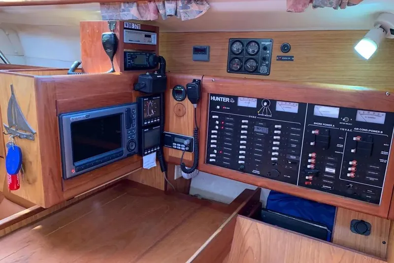 Slide: The Image of Interior control panel of a 2000 Hunter 460 sailboat with navigation and communication equipment. - 40