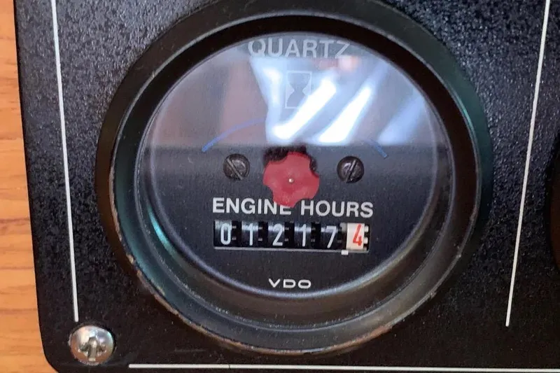 Slide: The Image of Engine hour meter reading 1217.4 hours on a 2000 Hunter 460 model. - 42