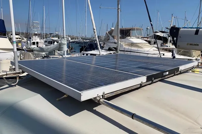 Slide: The Image of Solar panels on a 2000 Hunter 460 yacht in a marina setting. - 6