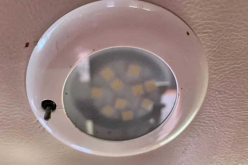 Slide: The Image of Ceiling light fixture in a 2000 Hunter 460 boat interior. - 64