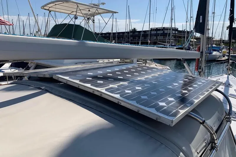 Slide: The Image of Solar panels on a 2000 Hunter 460 sailboat in a marina setting. - 7