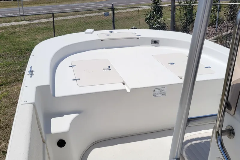 Slide: The Image of 2014 Carolina Skiff 218 DLV boat interior with storage compartments. - 10