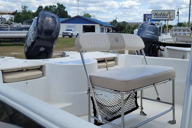 Slide: The Image of 2014 Carolina Skiff 218 DLV boat interior with seating and outboard motors. - 14