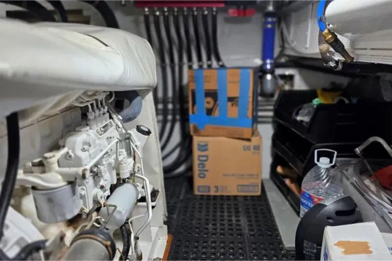 Slide: The Image of Engine room of a 1974 Chris-Craft 68 Roamer Flush Deck yacht, featuring mechanical components. - 10