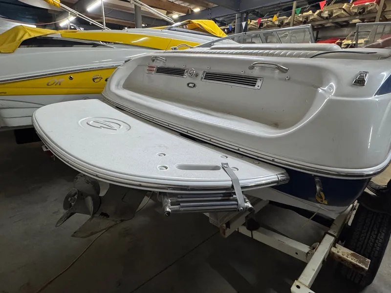 Slide: The Image of 2010 Crownline 180 BR boat on trailer in storage facility. - 10