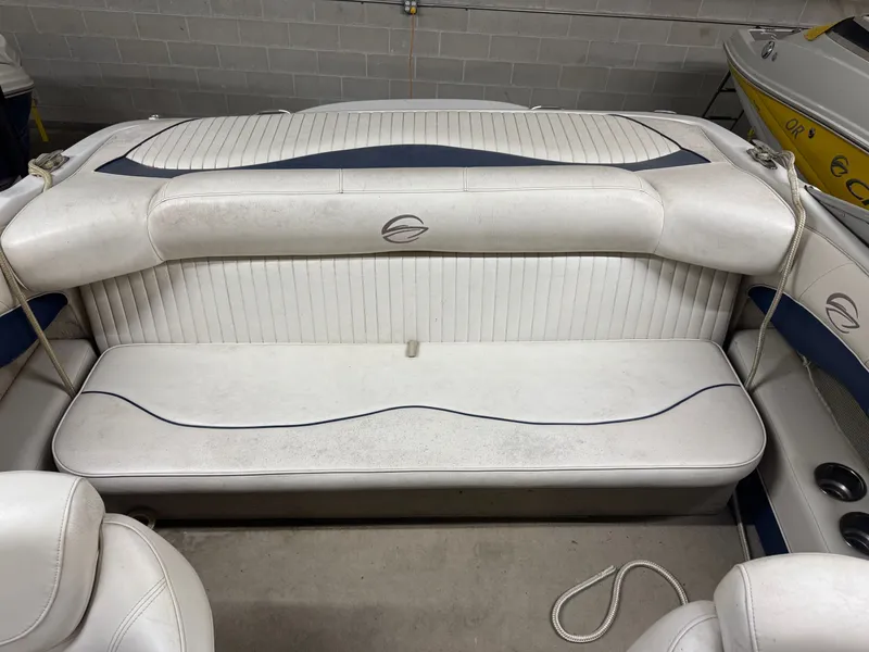 Slide: The Image of Interior of a 2010 Crownline 180 BR boat with white seating. - 2