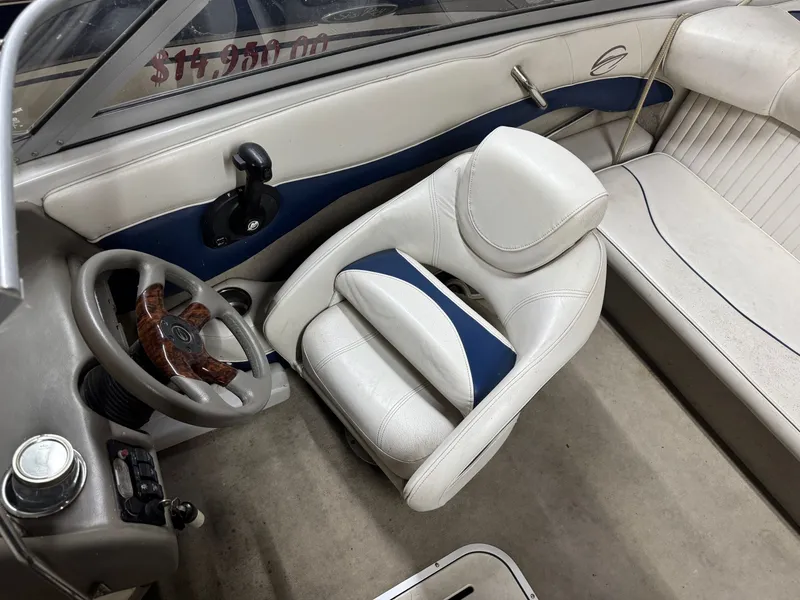 Slide: The Image of Interior of a 2010 Crownline 180 BR boat with white seating. - 3