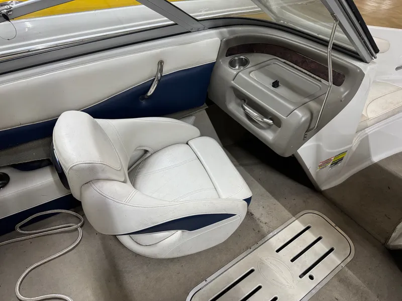 Slide: The Image of Interior of a 2010 Crownline 180 BR boat with white seating. - 5