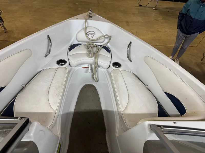 Slide: The Image of Interior of a 2010 Crownline 180 BR boat with white seating. - 6