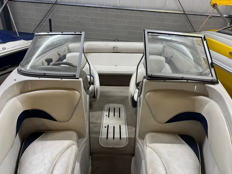 Slide: The Image of Interior of a 2010 Crownline 180 BR boat with seating and windshield. - 7