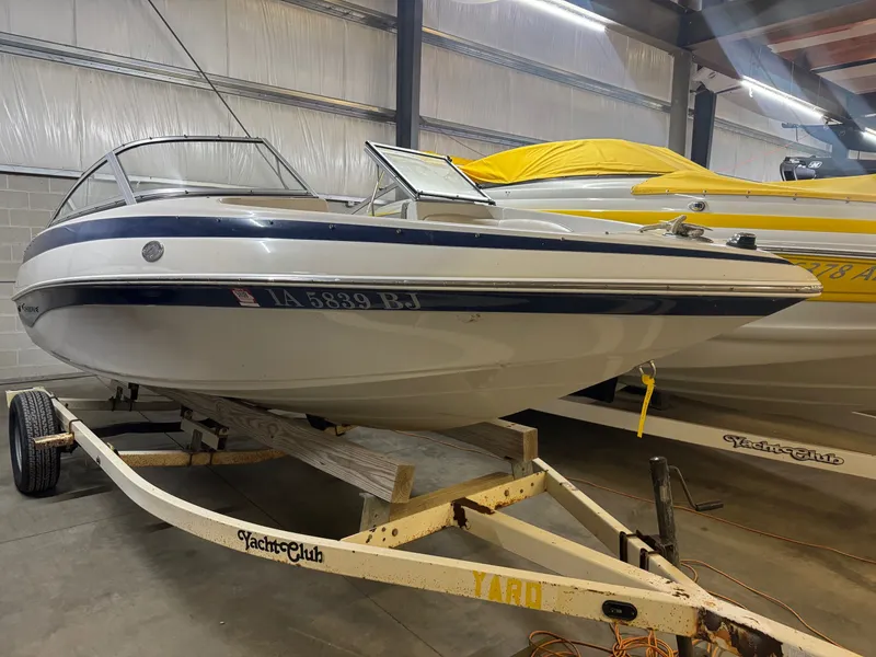Slide: The Image of 2010 Crownline 180 BR boat on trailer in storage facility. - 8