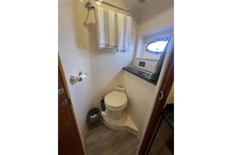 Slide: The Image of Bathroom interior of 2000 Carver 506 Motor Yacht with porthole window. - 15