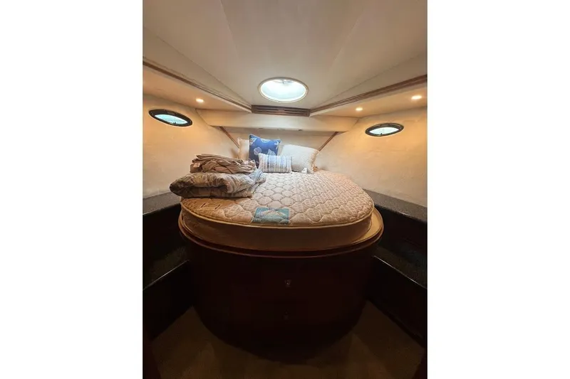 Slide: The Image of Luxurious bedroom interior of 2000 Carver 506 Motor Yacht with cozy bedding. - 18
