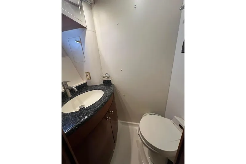 Slide: The Image of Bathroom interior of 2000 Carver 506 Motor Yacht with sink and toilet. - 23