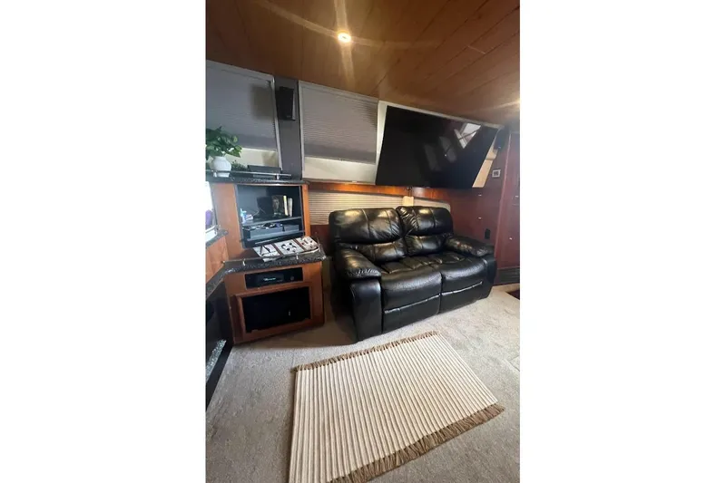 Slide: The Image of Luxurious interior of 2000 Carver 506 Motor Yacht with leather seating and entertainment center. - 3