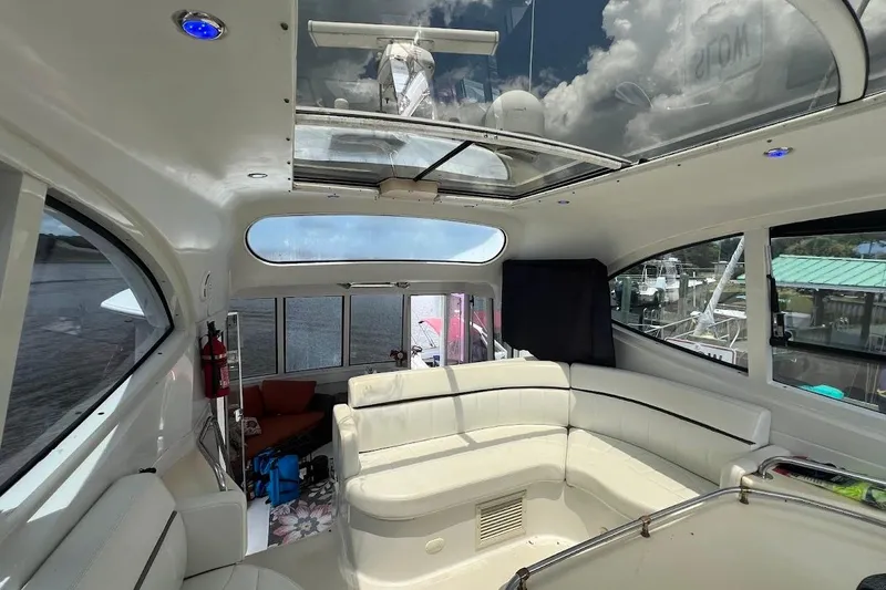 Slide: The Image of Interior of 2000 Carver 506 Motor Yacht with spacious seating and skylight. - 31