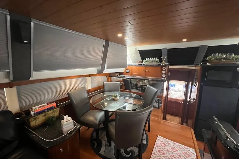 Slide: The Image of Luxurious interior of a 2000 Carver 506 Motor Yacht with elegant dining area. - 4