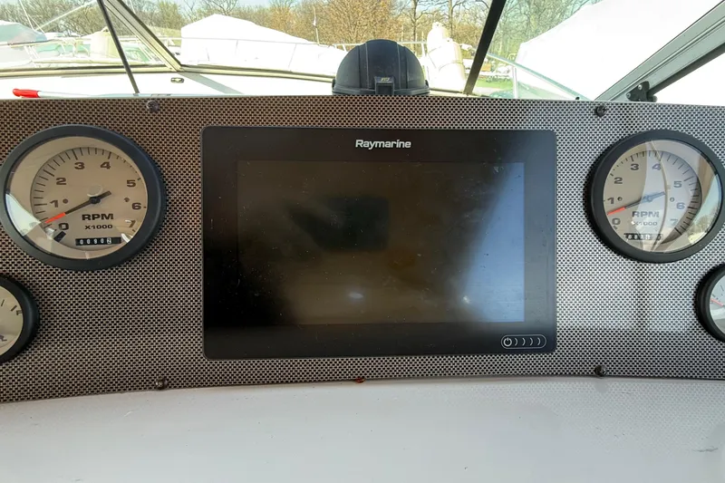 Slide: The Image of Dashboard of a 1992 Wellcraft 3400 Gran Sport boat with Raymarine display. - 11