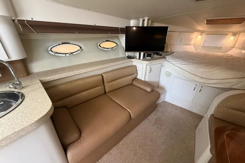 Slide: The Image of Interior of 1992 Wellcraft 3400 Gran Sport yacht with sofa, bed, and TV. - 15