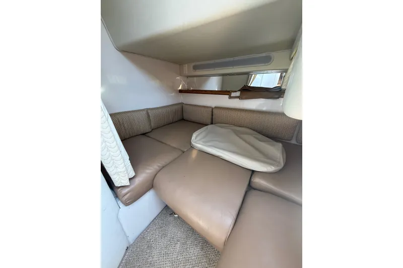 Slide: The Image of Interior cabin of 1992 Wellcraft 3400 Gran Sport with beige seating and cushions. - 16