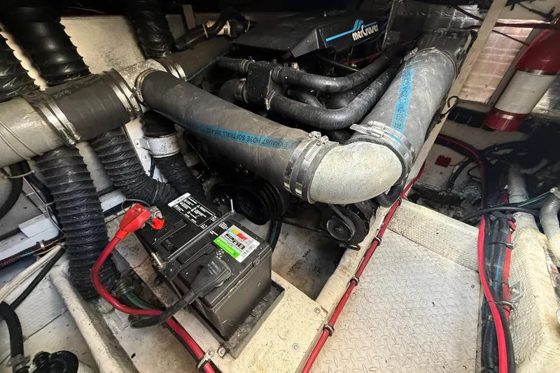 Slide: The Image of Engine compartment of a 1992 Wellcraft 3400 Gran Sport boat, featuring a MerCruiser engine. - 21