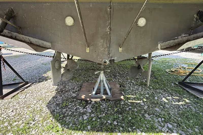 Slide: The Image of Bottom view of a 1992 Wellcraft 3400 Gran Sport boat on a stand. - 24