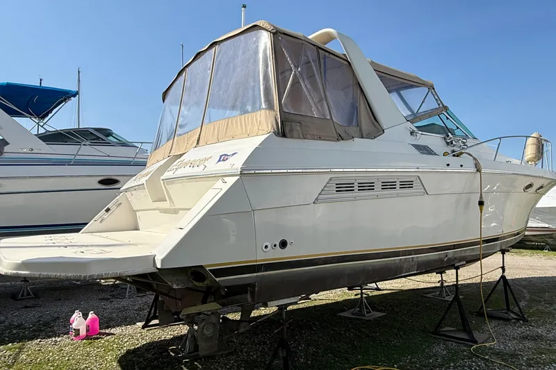 Slide: The Image of 1992 Wellcraft 3400 Gran Sport boat on stands, ready for maintenance. - 4